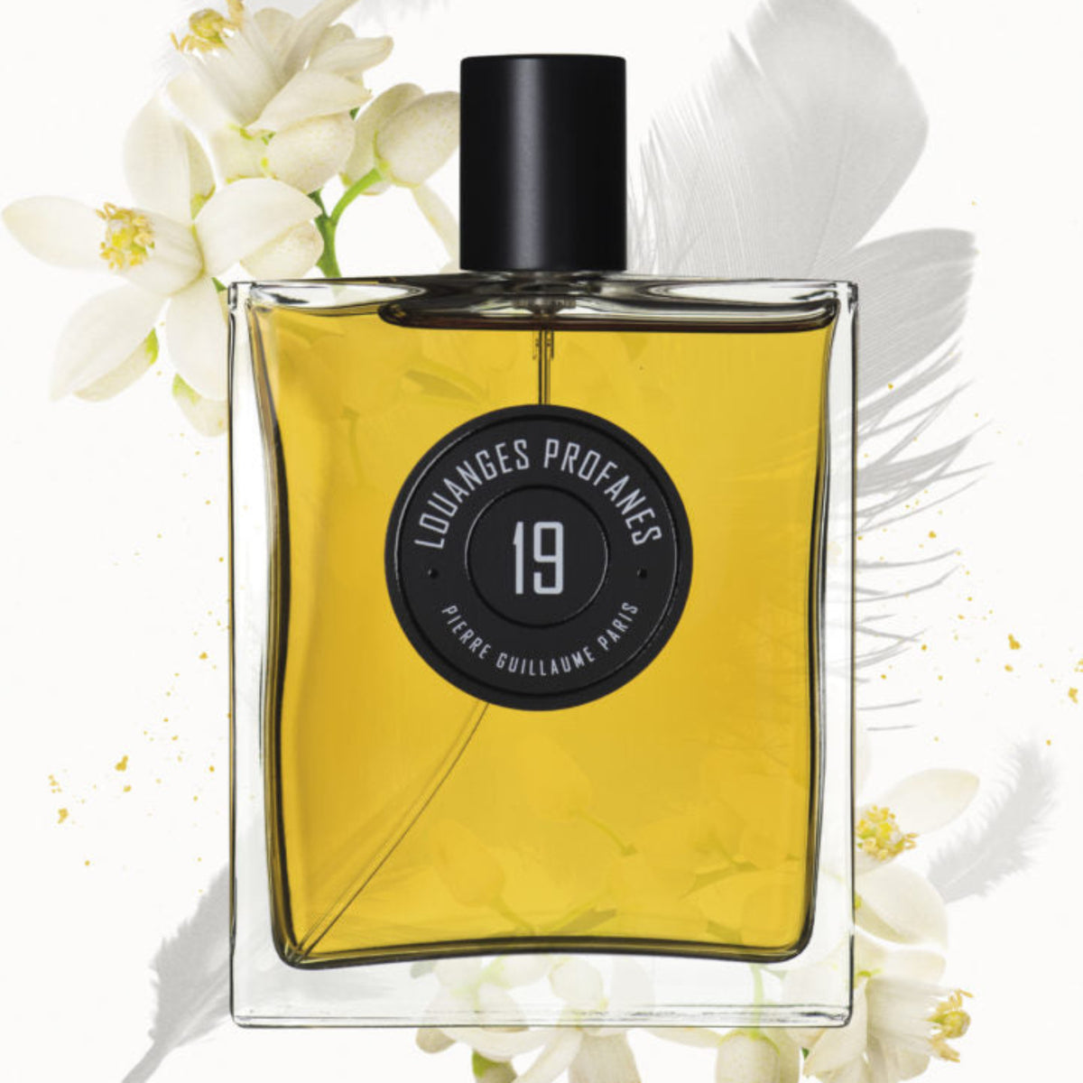 Perfume bottle with flowers on a white background