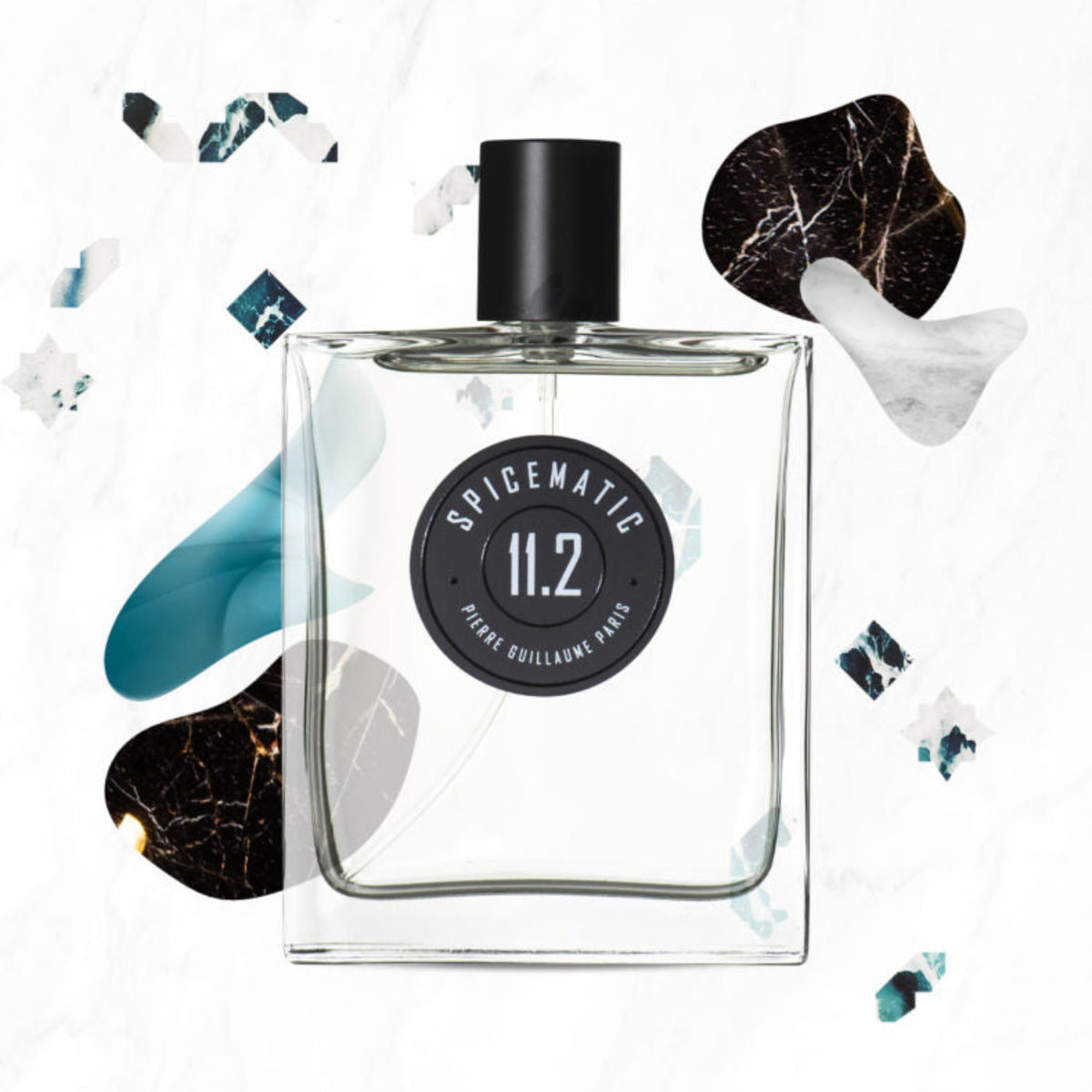 Clear perfume bottle with black cap and label on a white background